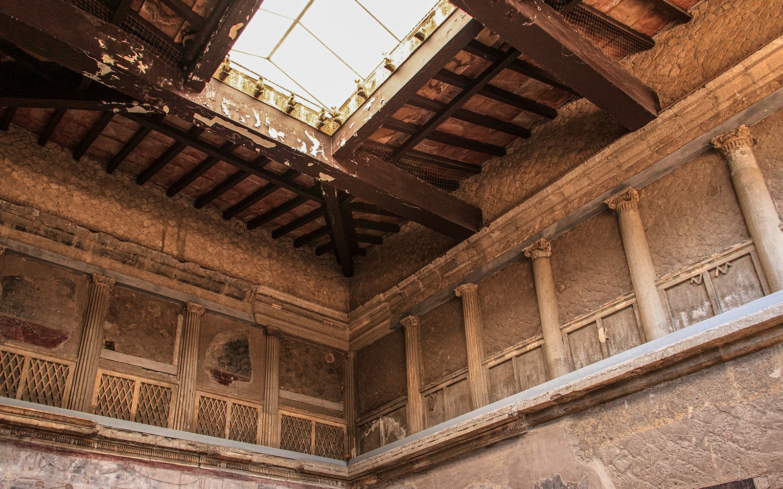 Samnite House ceiling fresco in Pompeii, Italy, showcasing intricate ancient Roman art.