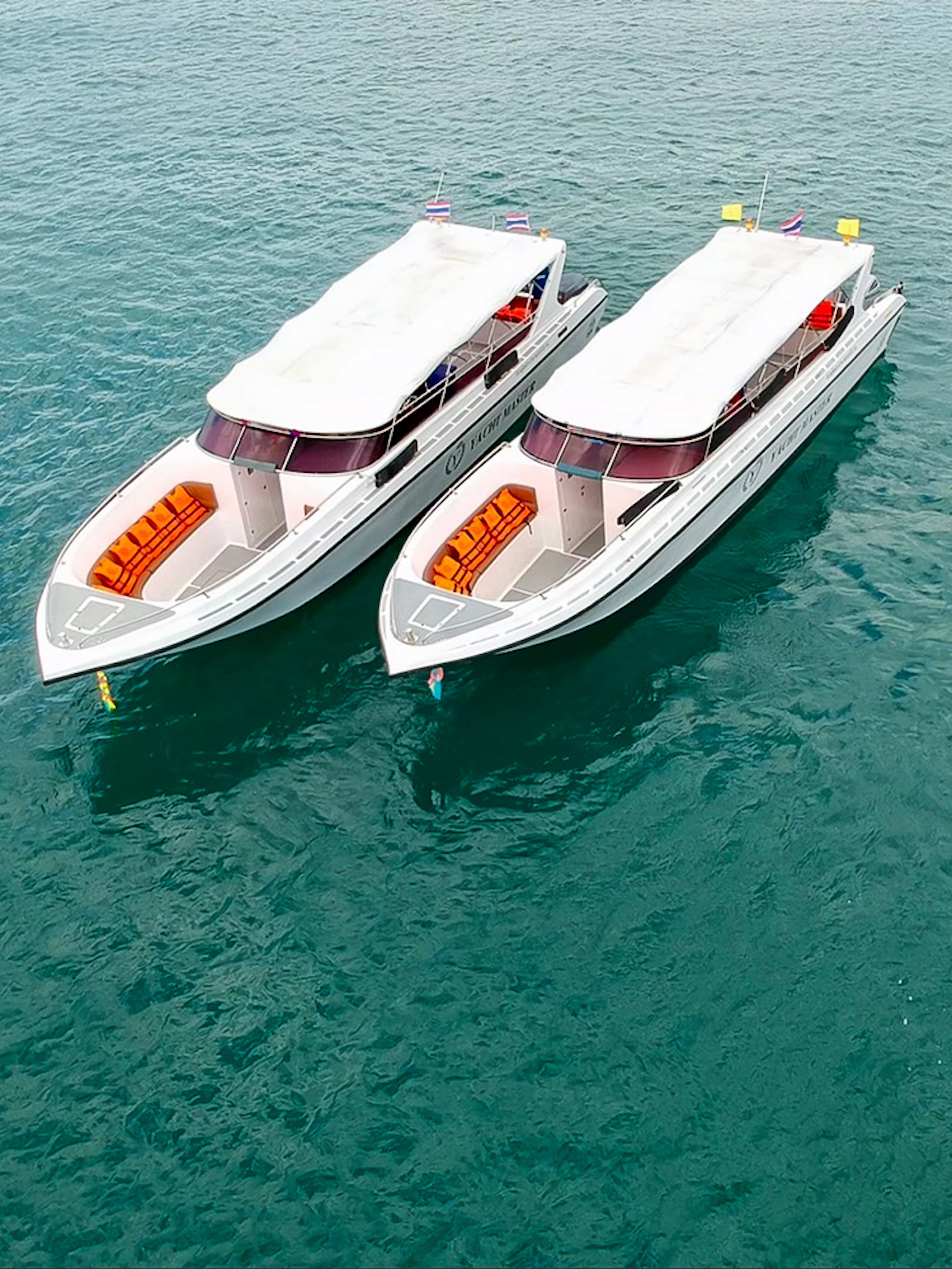 Speedboats on clear water for Phi Phi Island tour from Phuket.