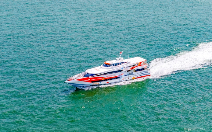 Ferry traveling from Singapore to Batam across the sea.