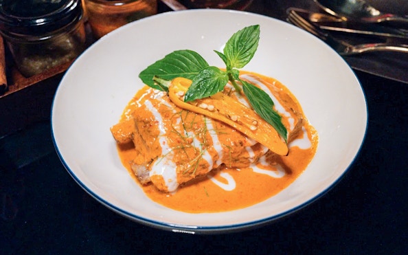 Thai curry dish served on Saffron Luxury Cruise by Banyan Tree.