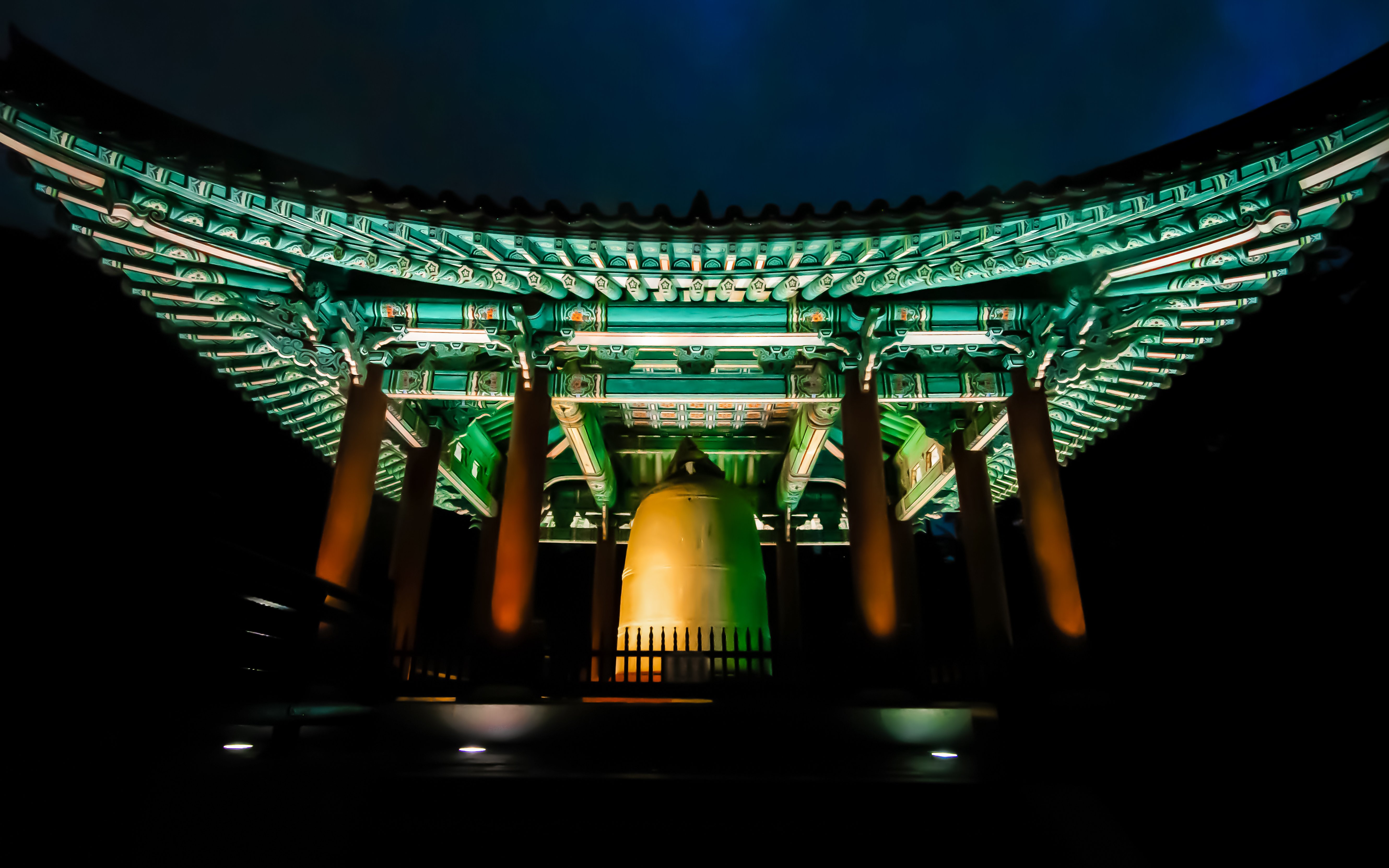 Bosingak Pavilion illuminated at night during the bell-ringing ceremony in Seoul, South Korea.