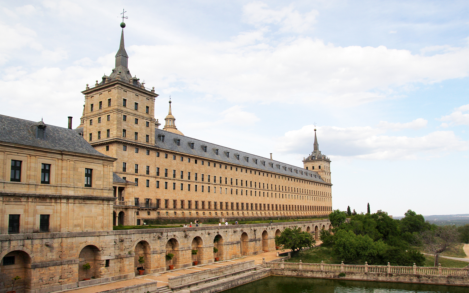 El Escorial Royal Pantheon exterior with stone facade and towers, San Lorenzo de El Escorial, Spain.