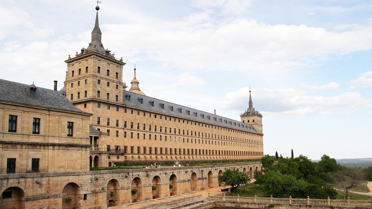 El Escorial Royal Pantheon exterior with stone facade and towers, San Lorenzo de El Escorial, Spain.