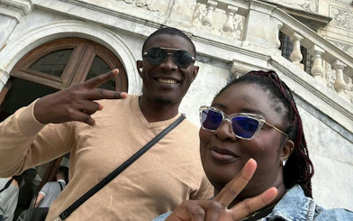 Couple posing in front of historic building during Pisa Romantic Walk, Pisa.