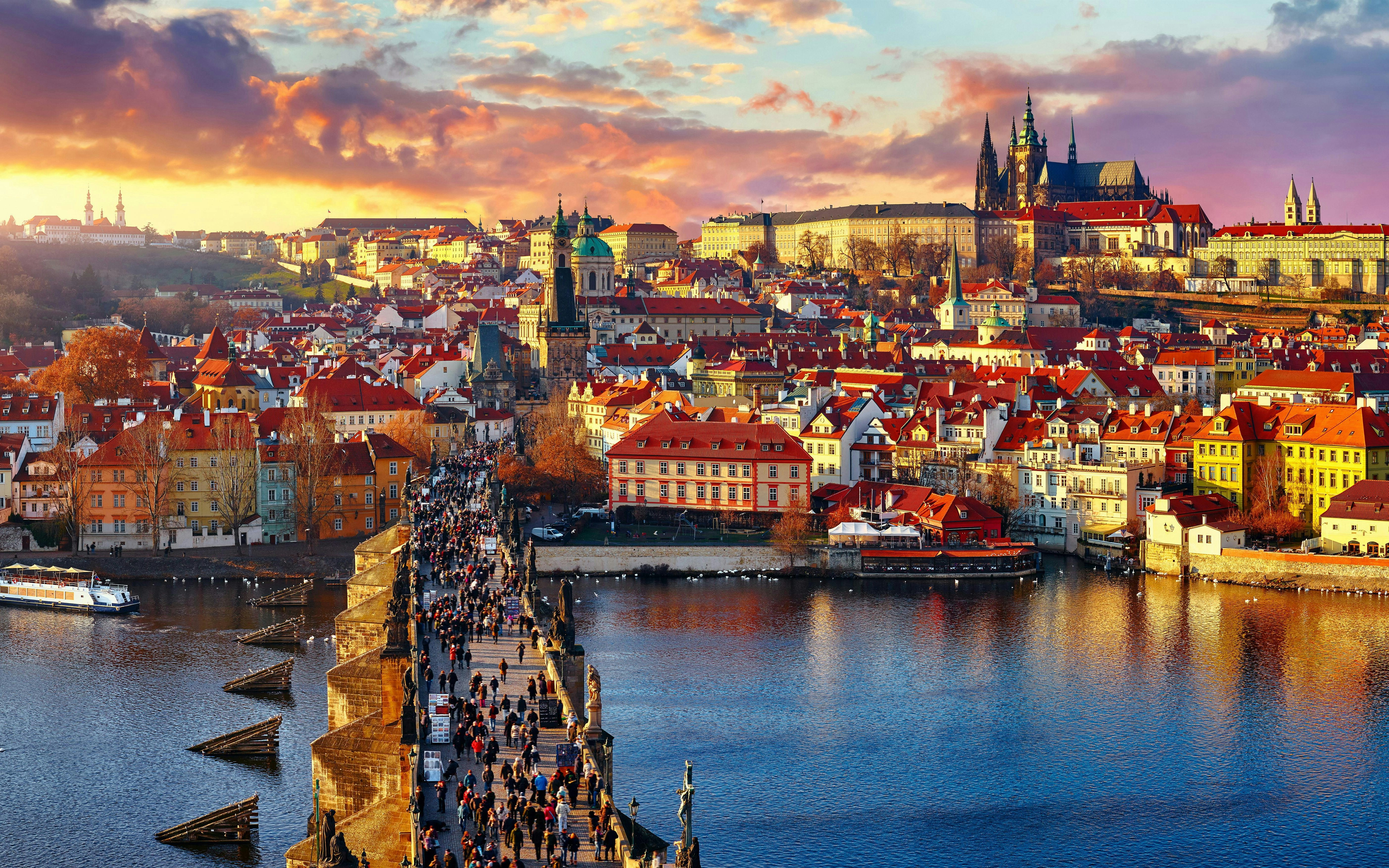 Panoramic view of Charles Bridge, Prague Castle, and Vltava River in Prague, Czech Republic.