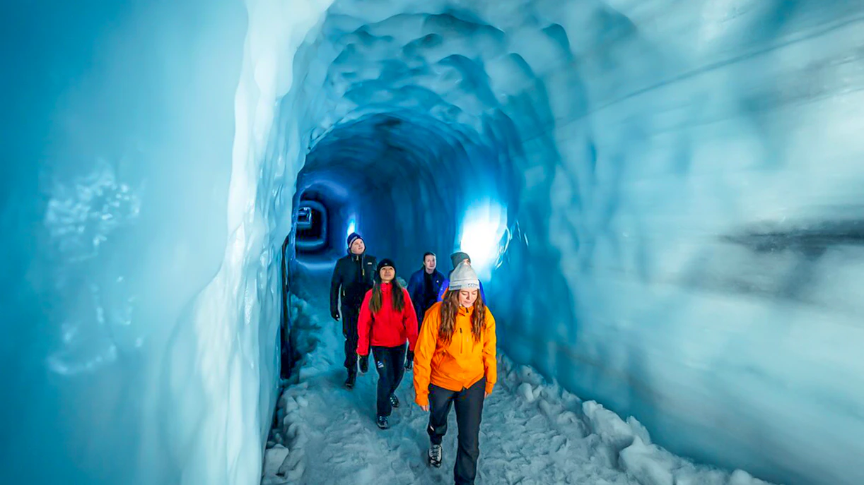 Guests walking through the Ice Tunnel in Langjökull Glacier, Iceland.