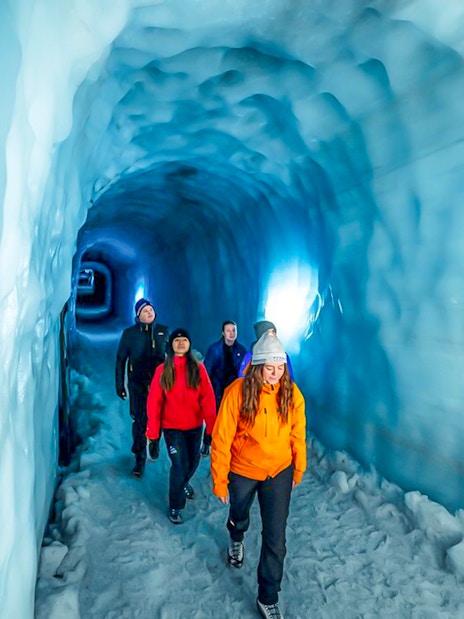 Guests walking through the Ice Tunnel in Langjökull Glacier, Iceland.