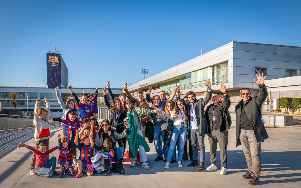 Group of visitors enjoying the Players Experience tour at Barça Museum and J. Cruyff Stadium.