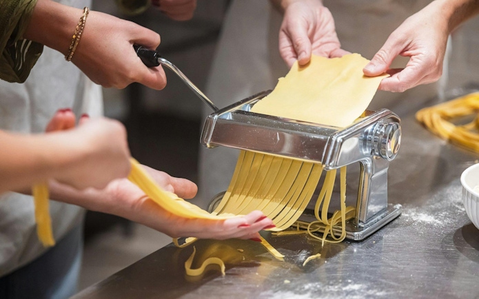 Making fresh pasta in a small group cooking class in Florence.