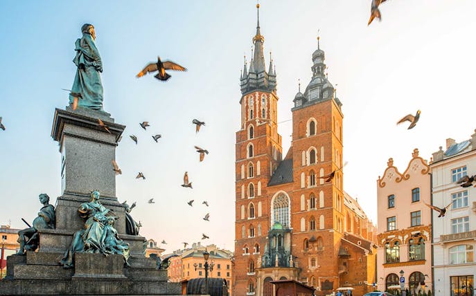 Krakow's Old Town with St. Mary's Basilica and Adam Mickiewicz Monument.