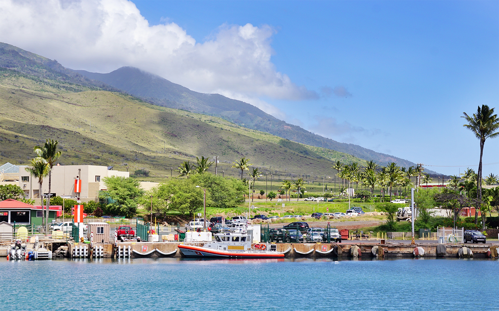 Maalaea Harbor with boats and lush hills on Maui's west coast, Hawaii.