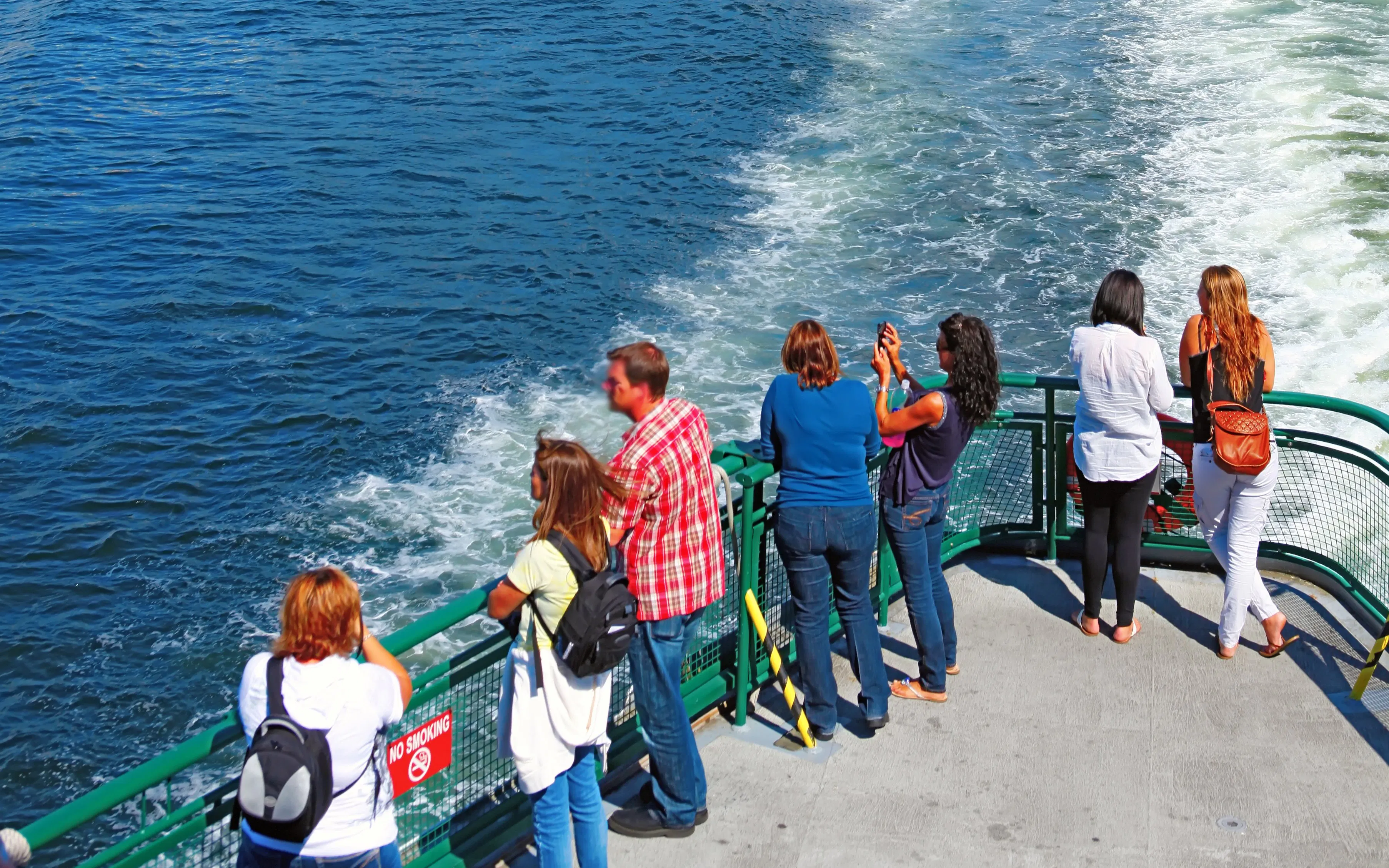Passengers on a ferry viewing Seattle's downtown skyline.