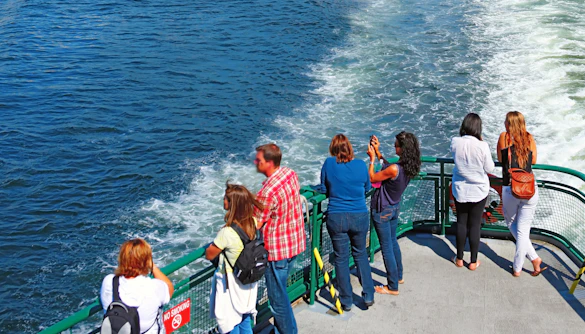 Passengers on a ferry viewing Seattle's downtown skyline.