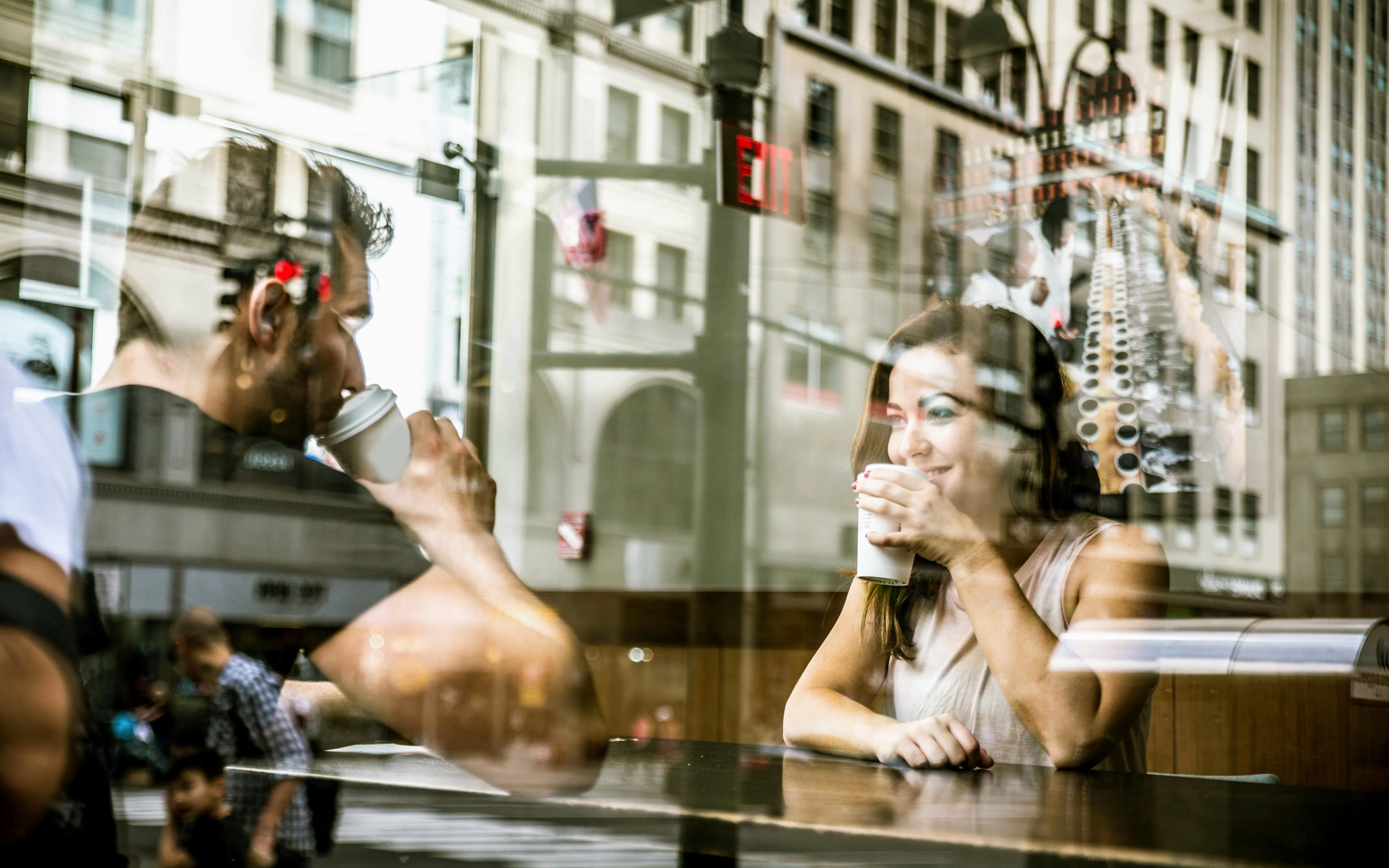 Couple enjoying coffee in a SoHo café, New York City.