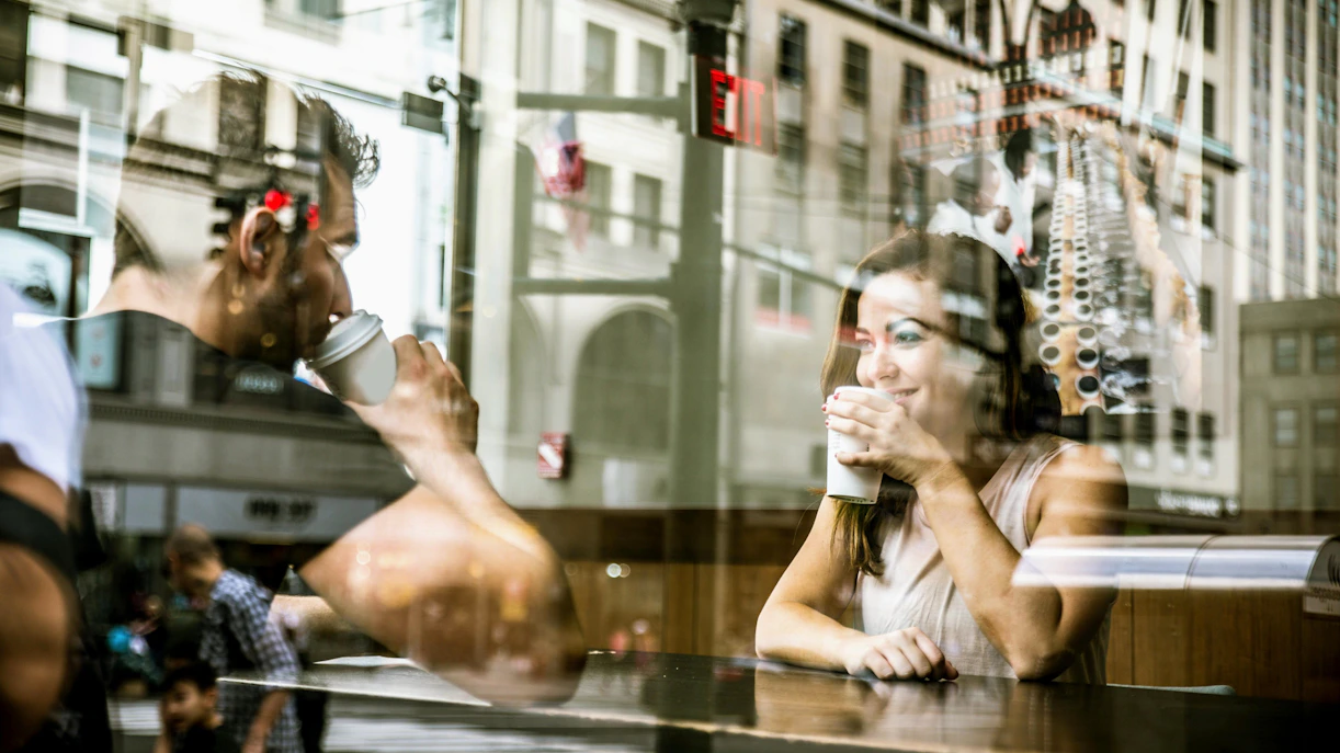Couple enjoying coffee in a SoHo café, New York City.