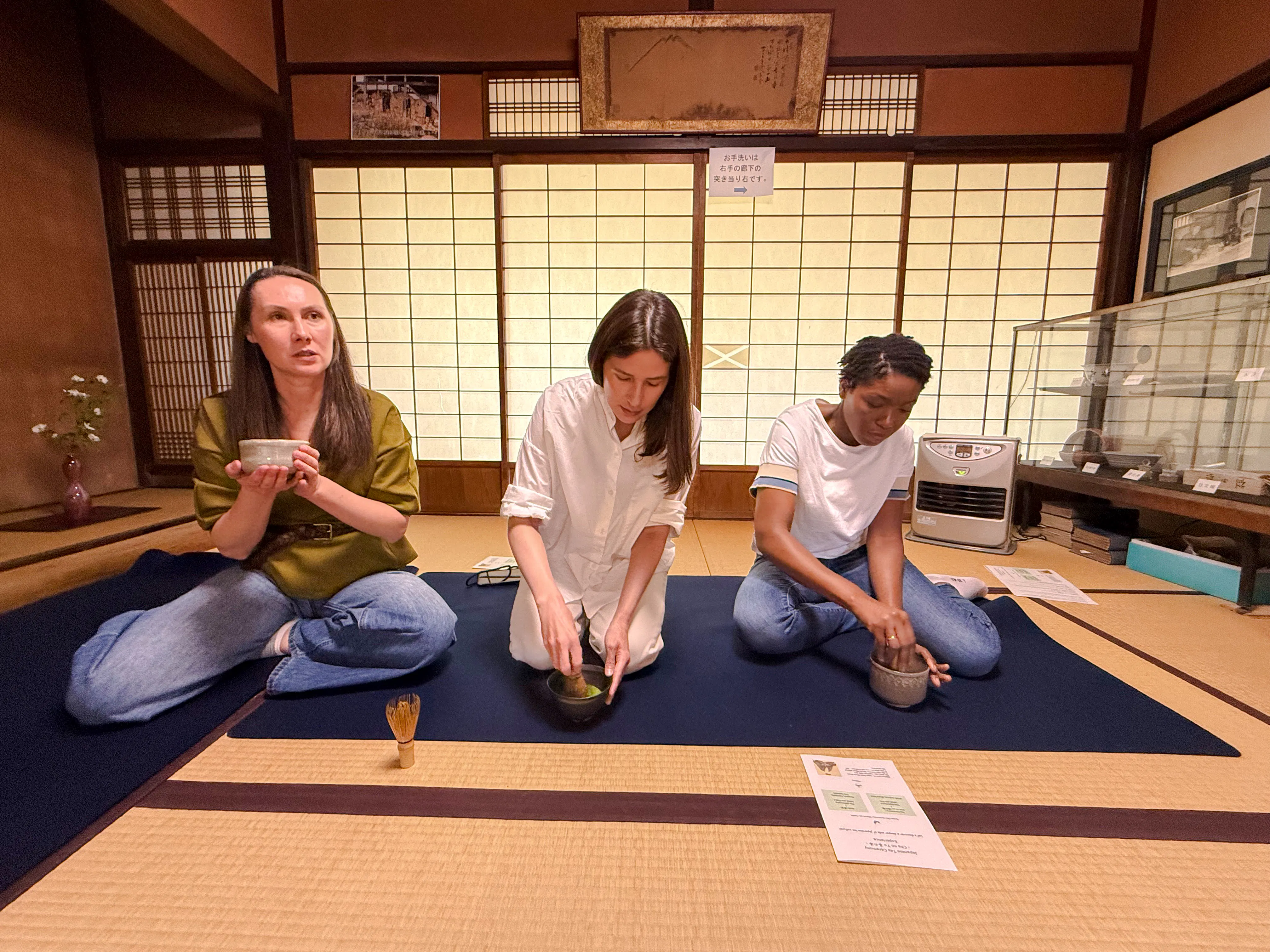 Participants engaging in a traditional tea ceremony at a cultural house in Hyogo.