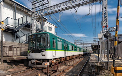 Kansai train at station under blue sky, part of Have Fun in Kansai 1 Week Pass.