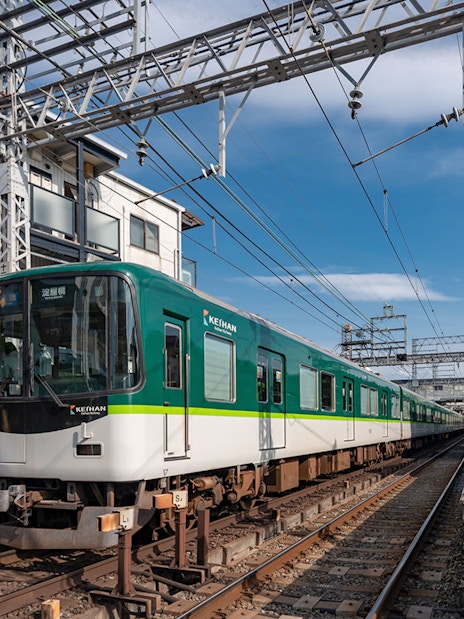 Kansai train at station under blue sky, part of Have Fun in Kansai 1 Week Pass.