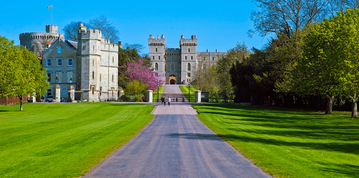 Windsor Castle entrance with pathway and surrounding gardens.