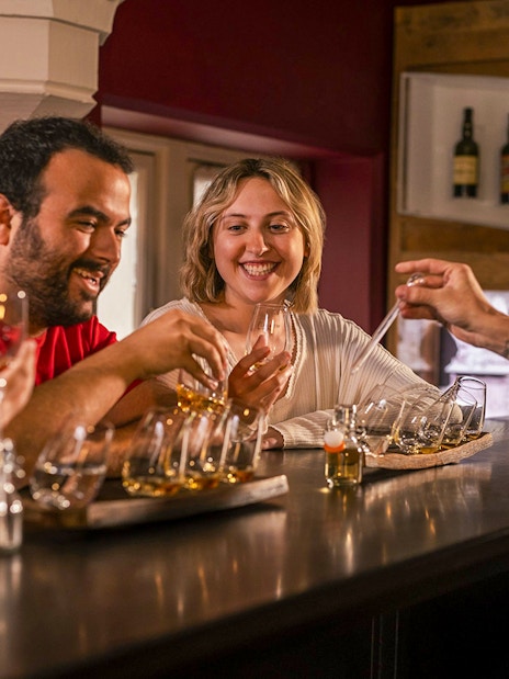 Guests enjoying whiskey tasting at the Irish Whiskey Museum tour.