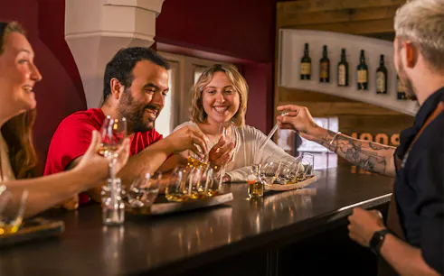 Guests enjoying whiskey tasting at the Irish Whiskey Museum tour.