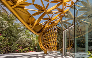 Al Noor Island Butterfly House entrance with intricate golden lattice design.