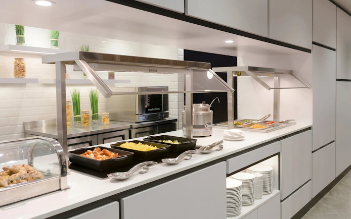 Buffet with hot dishes at Plaza Premium Lounge, Terminal 3, Toronto Pearson Airport.