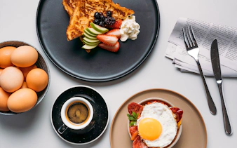 Breakfast spread with eggs, toast, fruit, and coffee at Plaza Premium Lounge, International Arrival.