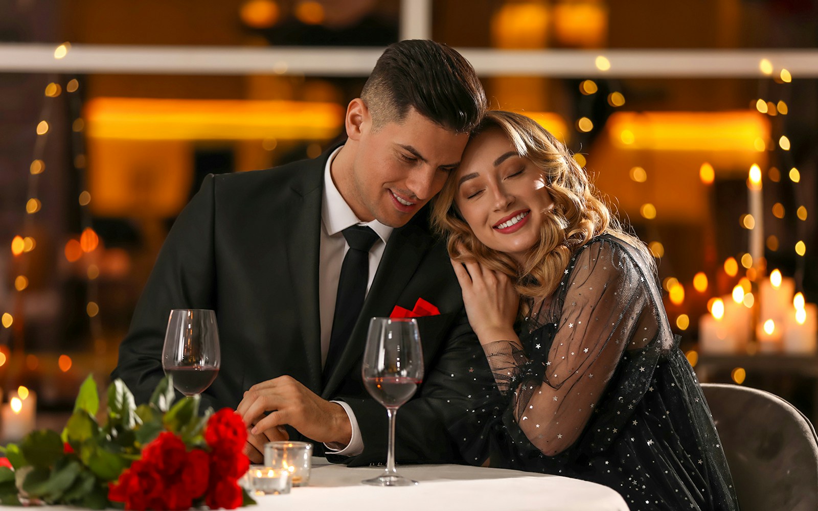Couple enjoying romantic dinner at Madame Brasserie, Eiffel Tower.