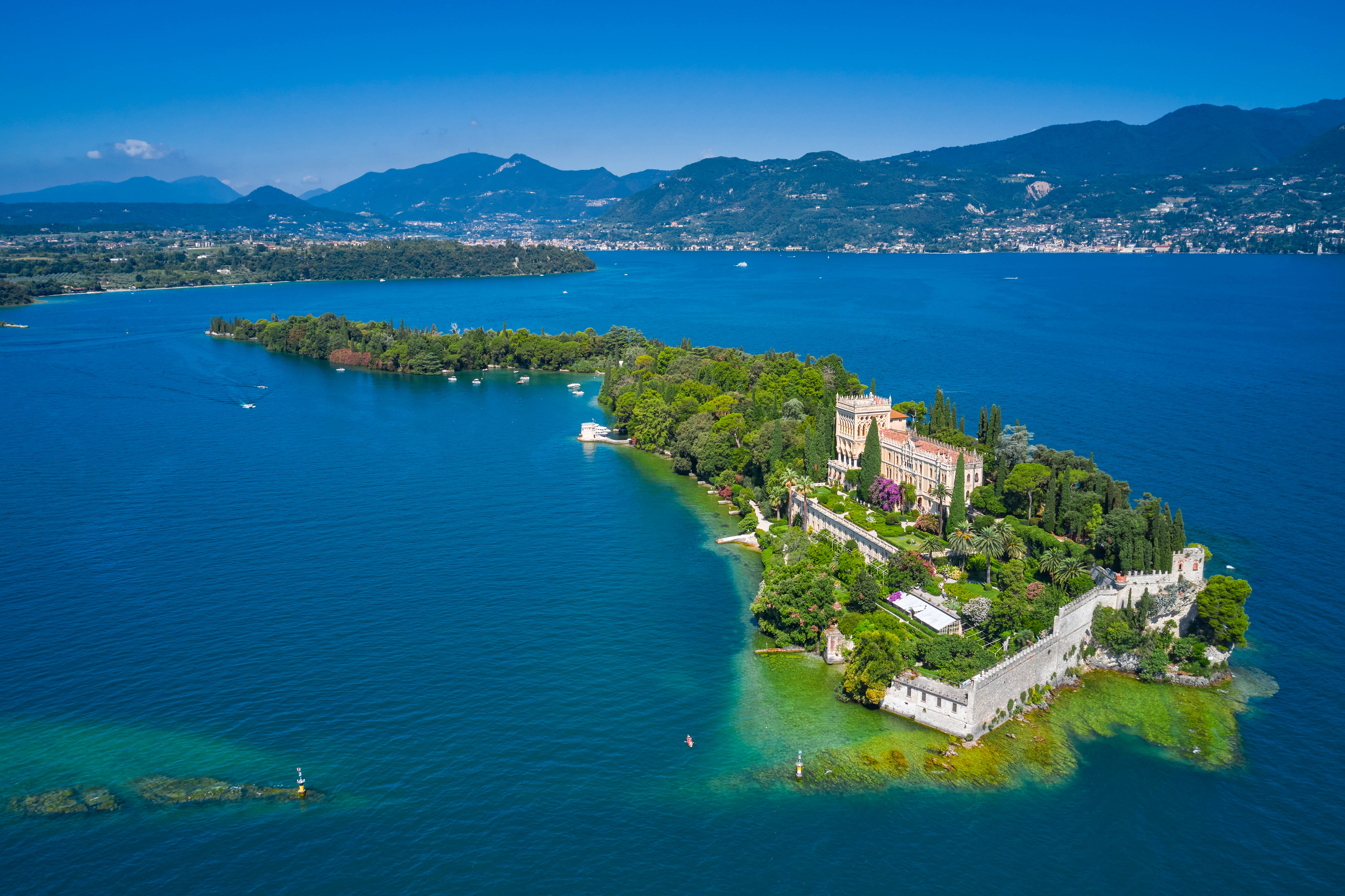 Aerial view of Lake Garda, Italy, showcasing its clear waters and surrounding mountains.