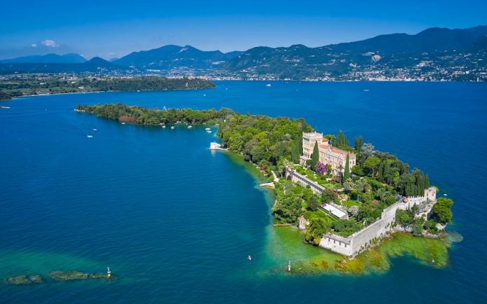 Aerial view of Lake Garda, Italy, showcasing its clear waters and surrounding mountains.