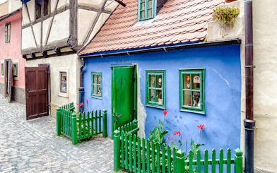 Blue house with green door and windows on Golden Lane, Prague.