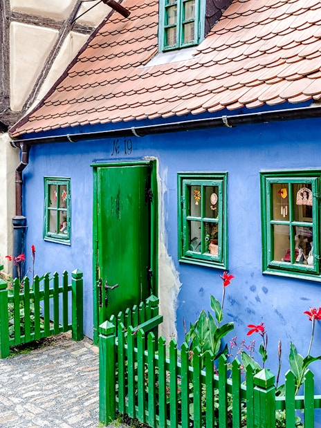 Blue house with green door and windows on Golden Lane, Prague.