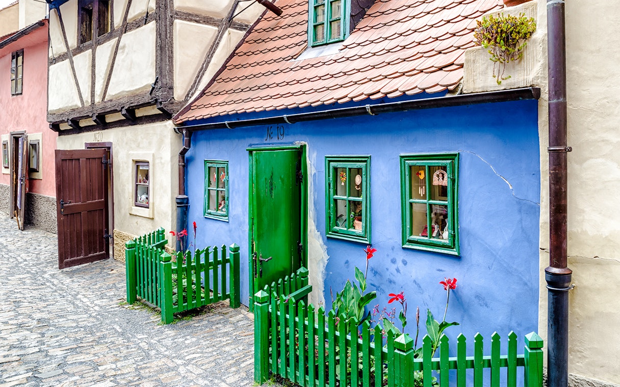 Blue house with green door and windows on Golden Lane, Prague.