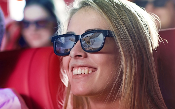 Visitor enjoying Malta 5D audio-visual show with 3D glasses.