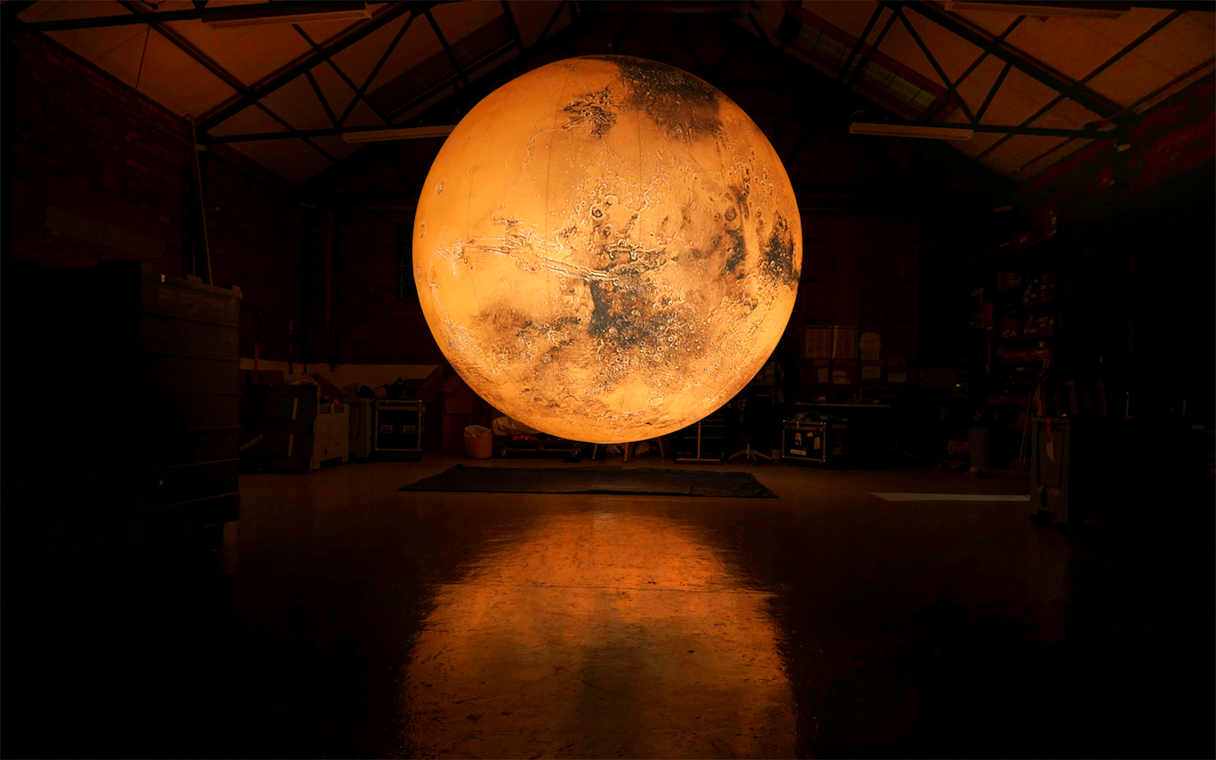 Illuminated globe installation at Singapore Future World Exhibition.