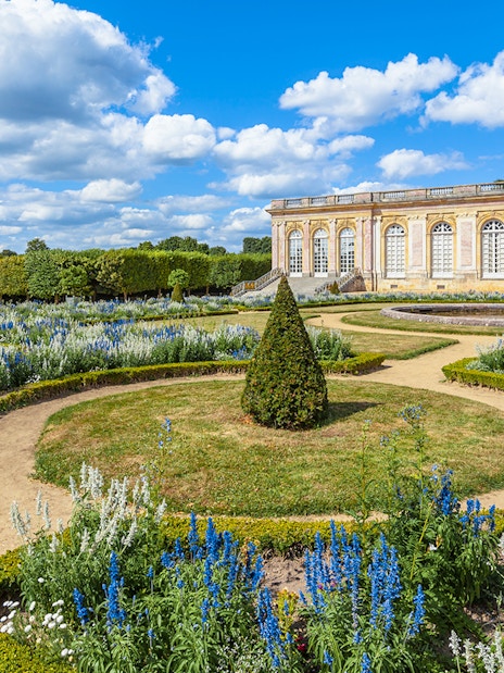 Garden paths and flowerbeds at the Grand Trianon Palace, Versailles, France.