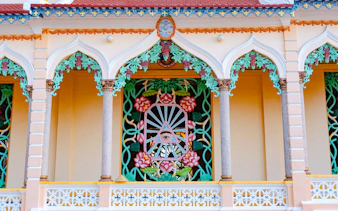 Cao Dai Temple facade with colorful ornate details, Ho Chi Minh City tour.