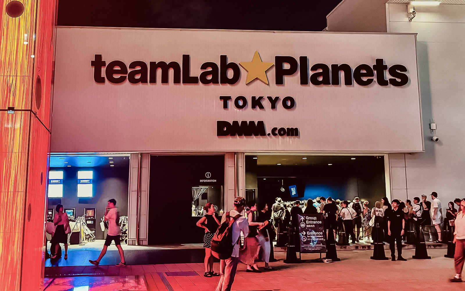 Visitors exploring the immersive digital art at teamLab Planets exhibit in Tokyo