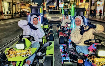 Go-kart riders on Dotonbori street during 75-min Monkey Kart experience in Shinsaibashi, Osaka.