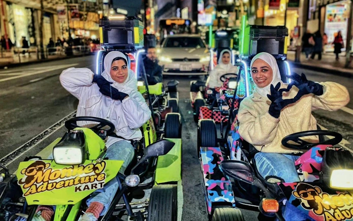 Go-kart riders on Dotonbori street during 75-min Monkey Kart experience in Shinsaibashi, Osaka.