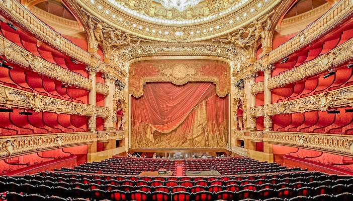 Red walled auditorium of opera garnier with royal seats