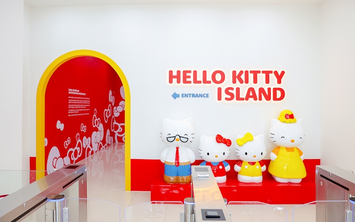 Hello Kitty Island entrance with character statues and colorful decor.