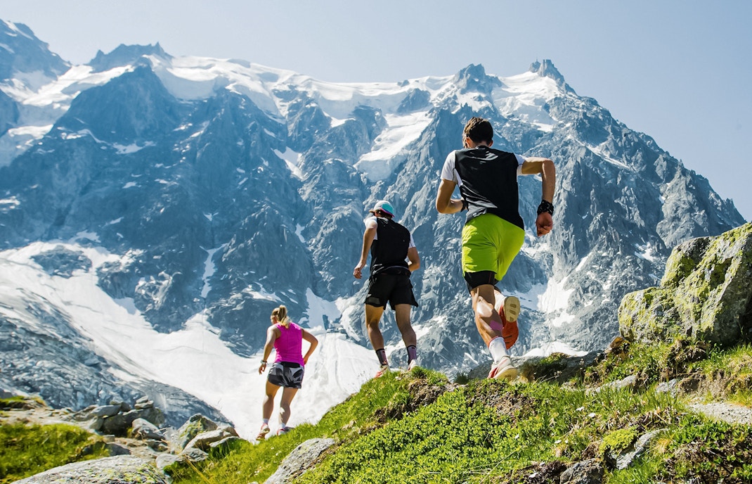 group of trail runners in mountains