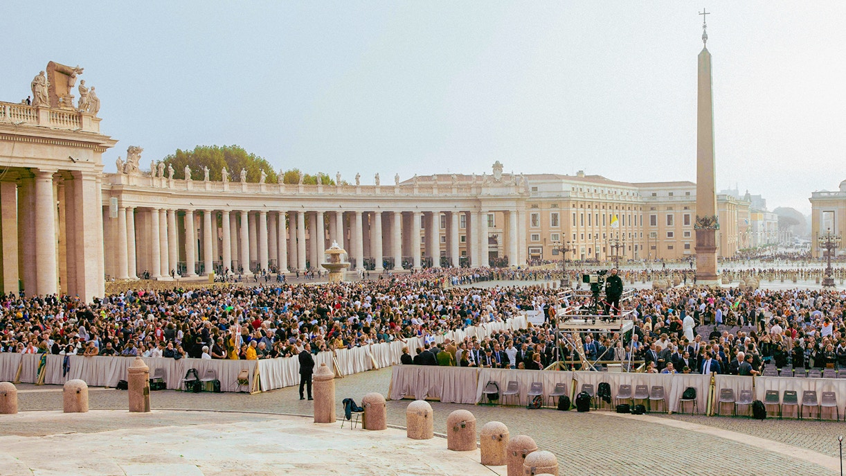 Vatican City crowd attending mass in St. Peter's Square.