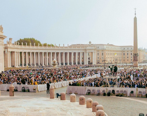 Vatican City crowd attending mass in St. Peter's Square.