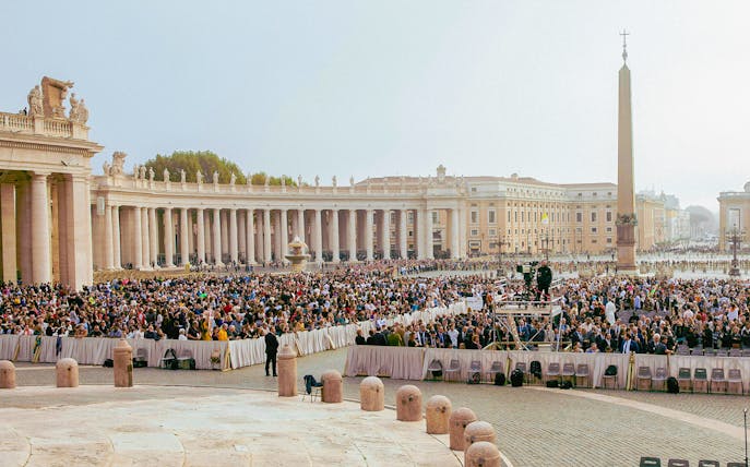 Crowd gathered at St. Peter's Square, Vatican City, for a mass event.