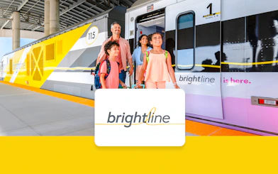 Brightline train with passengers boarding, Miami to Orlando route.