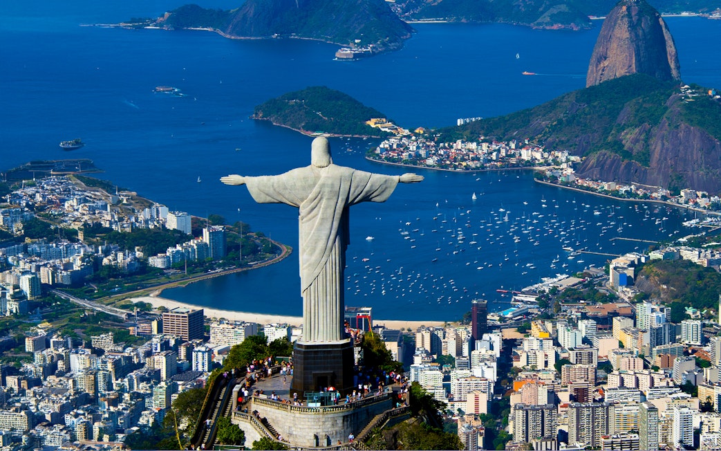 Aerial view of Christ the Redeemer overlooking Rio de Janeiro and Guanabara Bay.