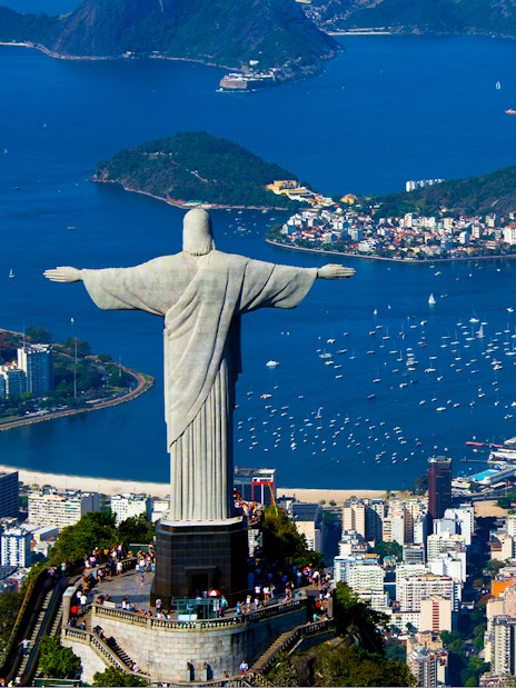 Aerial view of Christ the Redeemer overlooking Rio de Janeiro and Guanabara Bay.